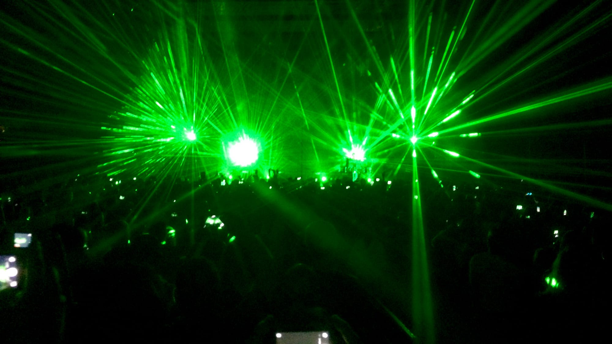 A picture from a concert with many lasers