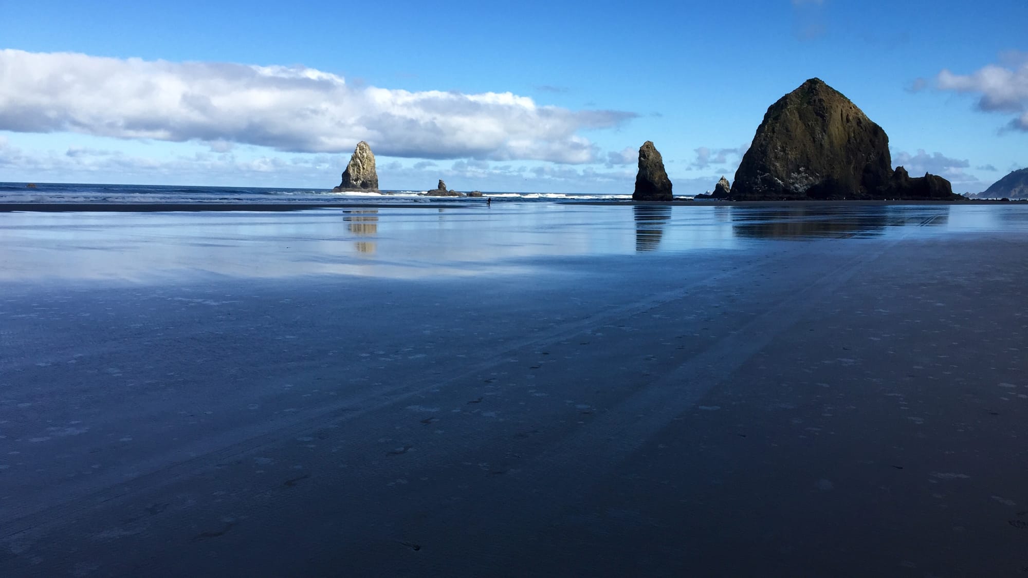 Haystack Rock on Cannon Beach in Oregon on a sunny day